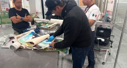 Detienen a extranjero que transportaba presunta cocaína en lienzos de fotografía dentro del AICM
